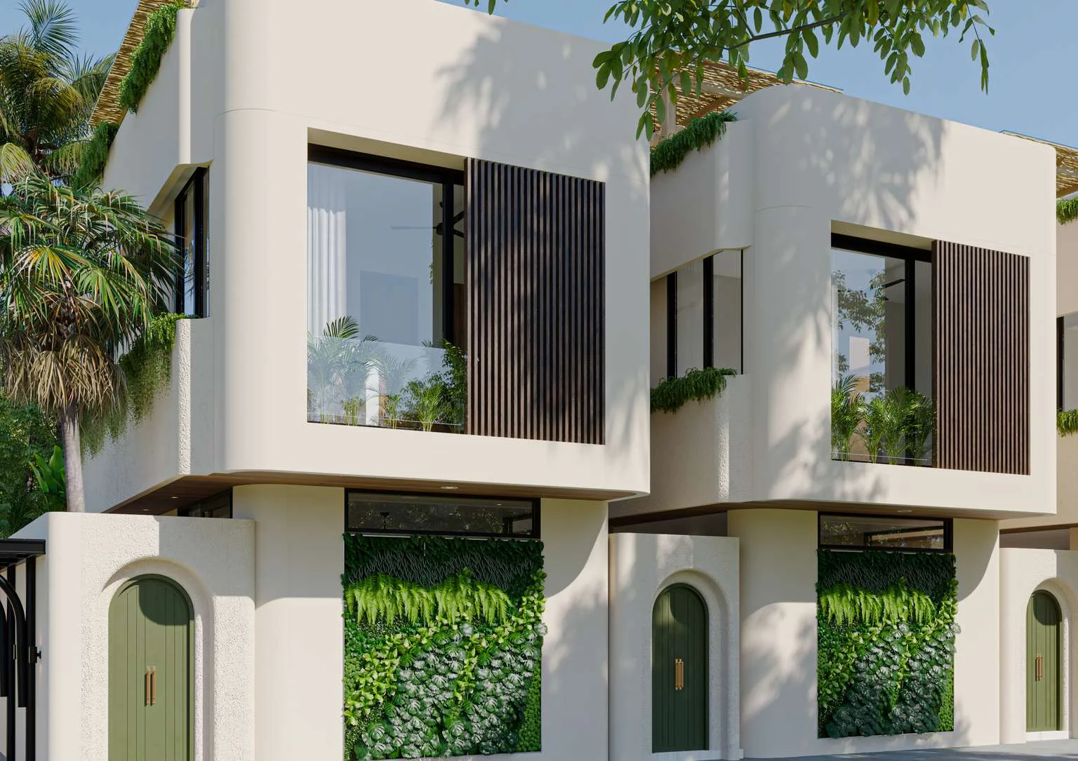 Sand plaster facade with an olive arched door and a wall of living ferns.