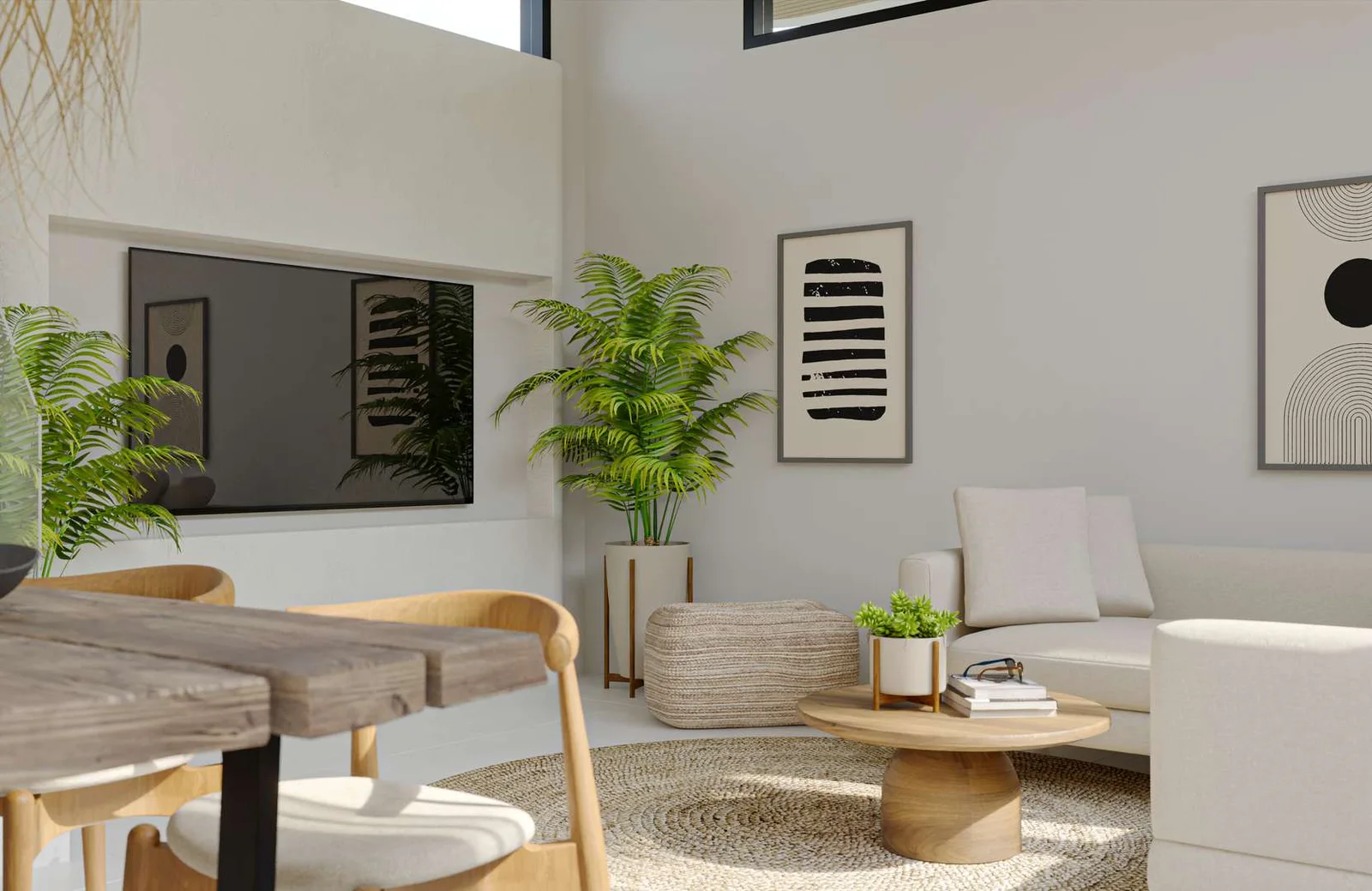 Living room in white plaster with a long timber table, a woven rug and framed prints.